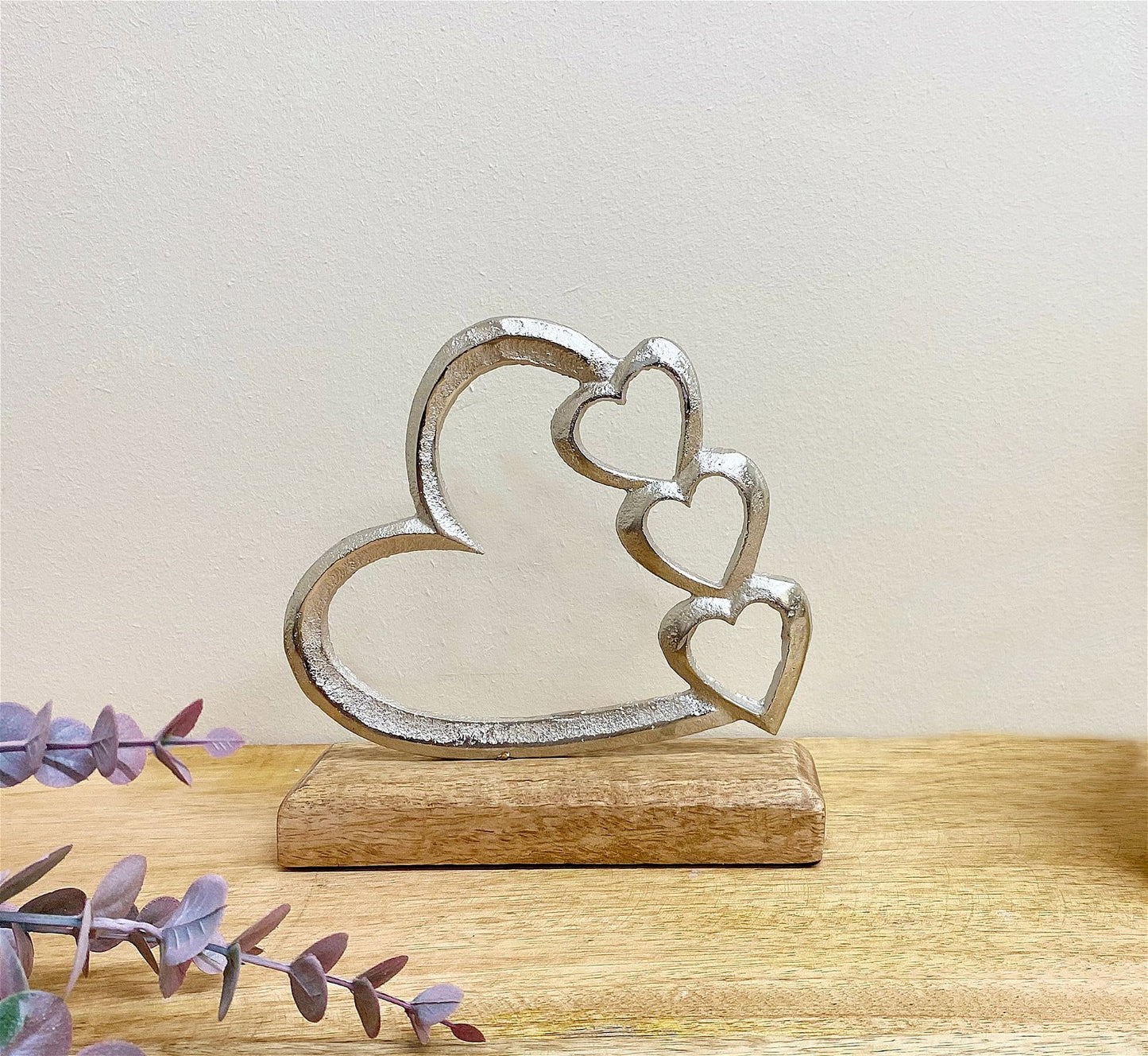 Metal Silver Four Heart Ornament On A Wooden Base Small