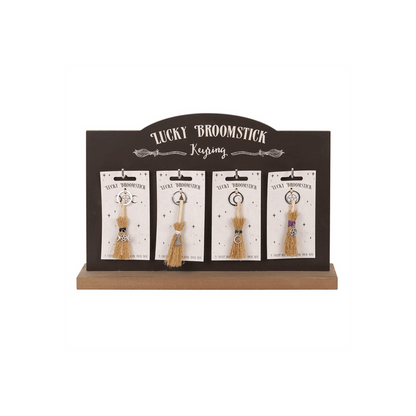 Set of 24 Lucky Broomstick Keyrings on Display - DuvetDay.co.uk